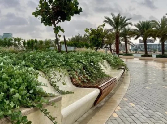 Walking track in Abu Dhabi Reem Central Park with greenery and benches