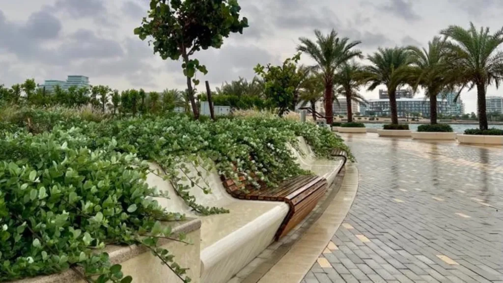 Walking track in Abu Dhabi Reem Central Park with greenery and benches