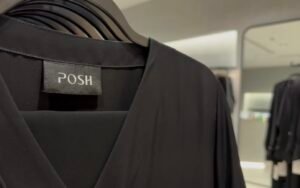 Close-up of a black abaya with Posh label tag inside the Abu Dhabi boutique.