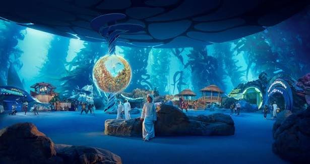 An underwater-themed attraction glowing blue scenery, marine-inspired structures, and digital displays.